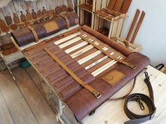 a bed made out of old leathers and wooden slats