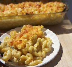 macaroni and cheese on a plate with a casserole dish in the background