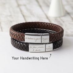 ► PERSONALIZATION This personalized leather bracelet makes a unique gift for your man for any special occasion. Keep it close to his heart with his kids' names/initial on one side, making it a unique gift for an anniversary or his birthday. ► PRODUCT DETAILS * Materials: 2 stainless steel magnetic clasps & PU leather cord. * Clasps size are approx 15/16'' x 3/8'' and 3/8'' x 3/8'' * Clasps' finishing color: silver * Word limits: 5-7 words for long side / 2-3 words for short side ► SIZING:  * Siz Dad Gifts From Kids, Gifts From Kids, Handwriting Bracelet, Personalized Leather Bracelet, Personalized Fathers Day Gifts, Dad Gifts, Personalized Christmas Gifts, Personalized Leather, Personalized Birthday