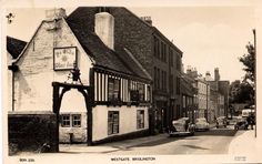 an old black and white photo of some buildings