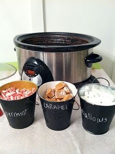 three buckets filled with marshmallows next to an electric pressure cooker