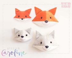 three little foxes made out of felt sitting next to each other