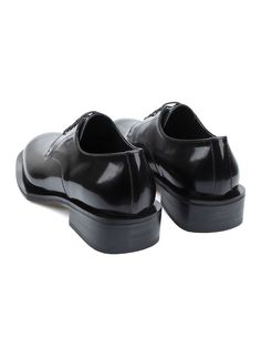 Editor's NotesSO.U:LESURES's Lune derby shoes feature a modern and chic silhouette and great to style with various outfits.- Round toe- Lace-up closureMeasurements(in.)- Size: KR220mm(US4) - KR300mm(US12)- Heel height: 1.6 in.- Fits true to the sizeComposition & Care- Box calf leather- Please check the care labelDesigner- by SO.U:LESURES Modern Oxford Lace-up Shoes For Formal Occasions, Modern Cap Toe Lace-up Shoes For Formal Occasions, Black Cap Toe Loafers For Derby, Modern Fitted Oxfords With Pointed Toe, Black Calf Leather Oxfords For Derby, Luxury Patent Leather Lace-up Shoes For Work, Sleek Pointed Toe Business Dress Shoes, Classic Pointed Toe Loafers With Rubber Heel Cap, Business Oxfords With Rubber Heel Cap In Patent Leather