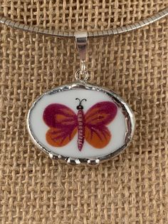 I created this butterfly pendant from a china cup.  Note the curvature of the piece in the attached pic.  It measures about 1" by 1 1/4" and is hung on a sterling bail.   Nice! Porcelain Necklace, Bottle Charms, Broken China, Funky Jewelry, Presents For Friends, Butterfly Pendant, Dream Jewelry, Stylish Jewelry, Pretty Jewellery