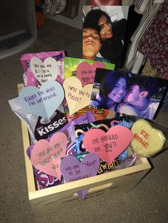 a wooden box filled with lots of valentine's day cards