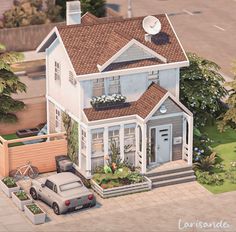 an aerial view of a two story house with a car parked in the front yard