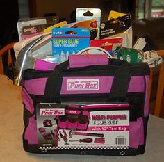 a pink and black lunch bag sitting on top of a table