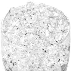 a glass container filled with lots of clear beads