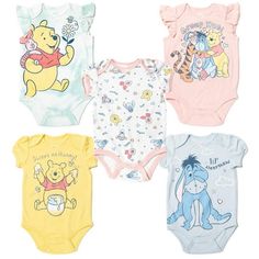 four baby bodysuits with winnie the pooh on them