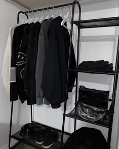 a rack with clothes and shoes hanging on it