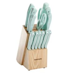 a set of knives in a wooden holder