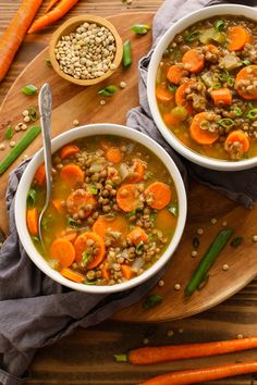 two bowls of soup with carrots and lentils