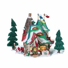 a christmas scene with a house and trees