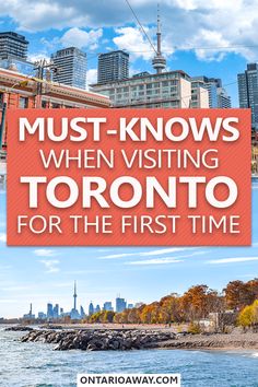 the toronto skyline with text that reads must - knows when visiting toronto for the first time