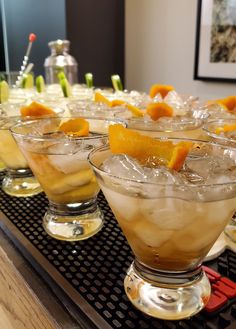 several glasses filled with different types of drinks