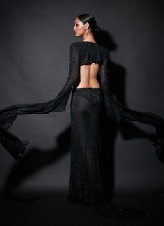 Editor's Note When looking for a black gown, stop here and choose this embellishments laden cutout gown. Fabric: Net Color: Black Neckline: V-plunge Sleeve type: Full Component: Gown Occasion: Cocktail and party Care: Dry Clean Only About the Designer Itrh makes a high-end luxury Indian ethnic wear made using exquisite and endangered age-old crafts such as kalamkari, madhubani, chikankari, zardozi, and gota weaving. The focus of the house is to cherish the beauty of handcrafted luxury designer w Wild Eagle, Blouse Yoke, Cutout Gown, Gown For Women, Ladies Gown, Gowns Online, Black Gown, Indian Ethnic Wear, Designer Wear