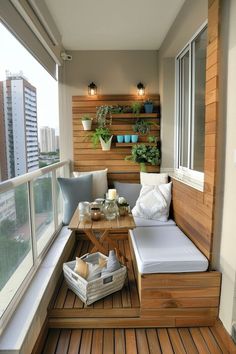 a wooden bench sitting on top of a hard wood floor next to a window filled with potted plants