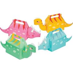 three dinosaur shaped paper toys sitting next to each other