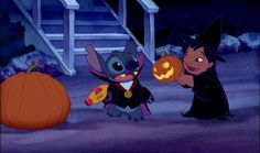 two children dressed up in halloween costumes holding pumpkins