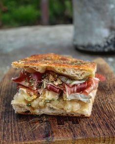 a close up of a sandwich on a cutting board