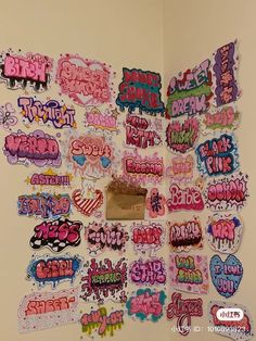 there are many stickers on the wall in this room, all different colors and sizes