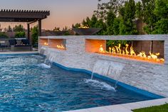 an outdoor fire pit next to a swimming pool