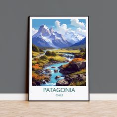 a poster with the name patagonia on it in front of a grey wall