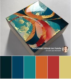 a box with an abstract painting on it and color swatches in the bottom right corner