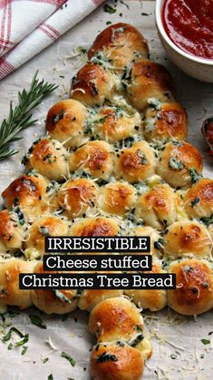 the bread is shaped like a christmas tree with cheese and herbs on it's sides