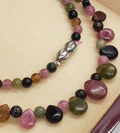 Round Tourmaline Gemstones, Tourmaline Gemstones With Gemstone Accents, Round Tourmaline Gemstones With Accents, Round Tourmaline Gemstones With Gemstone Accents, Pink Tourmaline Necklaces With Round Beads, Pink Tourmaline Beaded Necklaces, Handmade Tourmaline Gemstones, Tourmaline Necklace With Natural Stones And Round Beads, Multicolor Tourmaline Gemstone Beads Necklaces