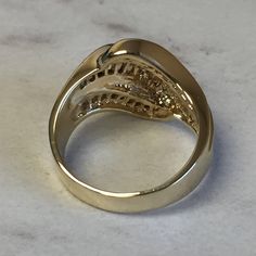 A stunning 14kt Yellow Gold Lady's Cubic Zirconia Baguette Channel Set Band with 1.50ct approx. total weight of all channel set straight baguette Cubic Zirconia (CZ) stones in finger size 7. This ring can be resized for an additional $95.00 upon request. The ring weighs 7.25 grams. Excellent band as a Wedding/Anniversary Gift. This item would Retail for $1,279.00 Dazzling Gold Diamond Ring With Baguette Diamonds, Gold Dazzling Diamond Ring With Baguette Diamonds, Gold Baguette Diamond Ring In Dazzling Style, Yellow Gold Diamond Ring With Baguette Diamonds, Oval Gold Rings With Baguette Diamonds, Yellow Gold Diamond Ring With Baguette Cubic Zirconia, Yellow Gold Jewelry With Baguette Cut Diamonds, Formal Yellow Gold Diamond Ring With Baguette Diamonds, Gold Baguette Cut Diamond Ring