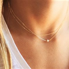 This Ultra Dainty Layered Necklace set of two necklaces is wonderful for everyday wear and for special occasions. A perfect way to wear layers with a minimal look and a touch of sparkle. •Two separate chains to wear together or alone •Top Layer - simple delicate chain •Bottom Layer - tiny freshwater pearl wrapped by hand 100% 14kt Gold-Filled or sterling silver Model is wearing 16-17" in Photos Everyday Layered Pearl Chain Necklace, Minimalist Multi-strand Jewelry With Delicate Chain, Everyday Delicate Double Strand Jewelry, Delicate Double Strand Everyday Jewelry, Delicate Double Strand Everyday Layered Necklace, Delicate Double Strand Everyday Necklace, Delicate Everyday Double Strand Layered Necklace, Simple Necklace With Delicate Chain For Layering, Dainty Double Chain Everyday Jewelry