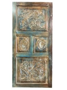 a wooden door with carvings on it