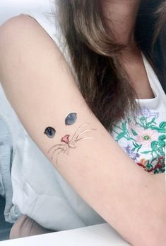 #TattooArt #InkLife #BodyArt #TattooInspiration #InkedUp #TattooLove #TattooedWomen #TattooedMen #InkCommunity #TattooStories Meow Tattoo, Cat Eye Tattoos, Kitty Tattoos, Bamboo Tattoo, Button Nose, Real Tattoo, Eye Tattoo, Cat Eyes, Mandala Tattoo