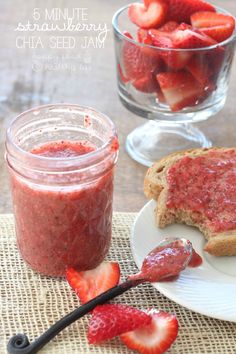 strawberry chia seed jam in a glass jar with toast and strawberries on the side