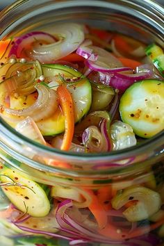 a glass jar filled with sliced up vegetables