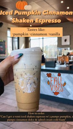 a person holding up a starbucks cup with the words iced pumpkin cinnamon shaker espresso