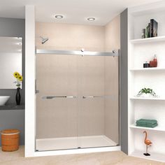 a bathroom with a walk in shower next to a white shelf filled with towels and other items