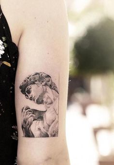 a woman with a tattoo on her arm