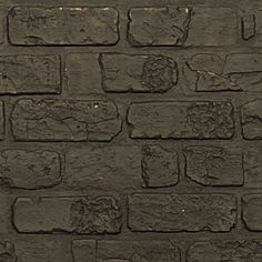 an old brick wall that has been painted black and is being used as a background