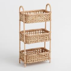 three wicker baskets are stacked on top of each other in the shape of a shelf