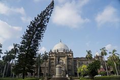 a large building with many trees around it