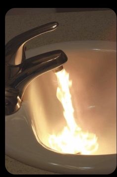 a sink that has fire coming out of it