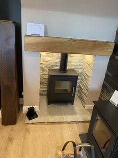 a wood burning stove sitting inside of a living room