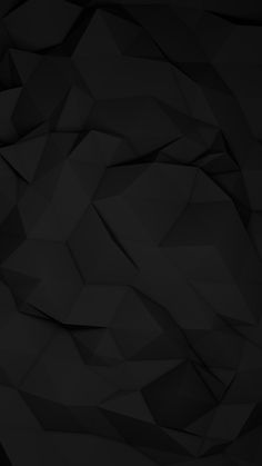 an abstract black background consisting of triangular shapes