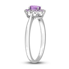 Embark on your forever journey together with this beautiful gemstone and promise ring. An exquisite oval-cut amethyst is simply radiant when embraced by a colorful halo of round-cut amethysts. The floral-inspired silhouette is fashioned in stylish sterling silver. Oval Amethyst Ring With Halo Setting For Promise, Purple Diamond Ring With Halo Setting And Round Cut, Purple Sapphire Ring With Halo Setting For Promise, Purple Birthstone Ring With Halo Setting For Promise, Purple Birthstone Promise Ring With Halo Setting, Purple Halo Setting Birthstone Promise Ring, Oval Purple Birthstone Promise Ring, Formal Purple Birthstone Ring With Halo Setting, Purple Diamond Halo Ring