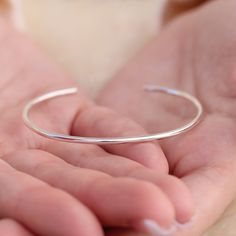 These matte silver bangle cuffs have a soft and luminous shimmer that is elegant and feminine. They have a comfortable fit that is custom tailored to your wrist size and a recycled sterling silver body that will last. This cuff is 2mm thick and is a strong and simple cuff bracelet. Simple Cuff Bracelet, Silver Bodies, Would You Rather, Silver Bangle, Recycled Sterling Silver, Custom Tailoring, Silver Bangles, Silver Cuff, Silver Bracelets