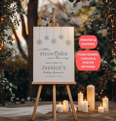 an easel with candles and a sign that says, let the snowflake welcome to jesusic's