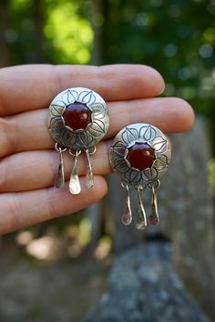 These Mandala Studs are to die for. Featuring beautiful red Carnelian and hand-stamped mandala flower patterns with handmade dangles. Made with .925 Sterling Silver and lots of love. Individually weighing in at 6.6 Grams / .23 Oz you are going to love these babes <3 Bohemian Stamped Dangle Jewelry, Bohemian Red Jewelry Stamped 925, Red Carnelian, Mandala Flower, Indian Jewelry Sets, Lots Of Love, Flower Mandala, Jewelry Earrings Studs, Indian Jewelry