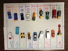 a bunch of toy cars are lined up on a bulletin board